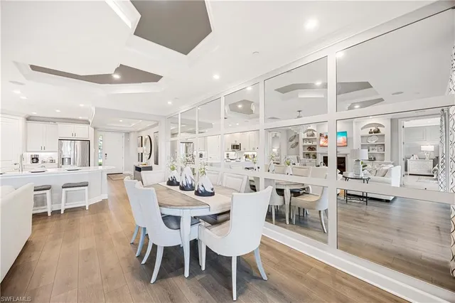 a view of a dining area with furniture and wooden floor
