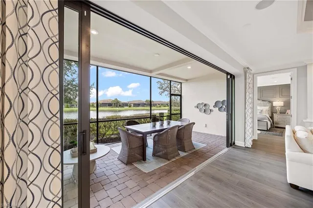 a living room with a large window and table
