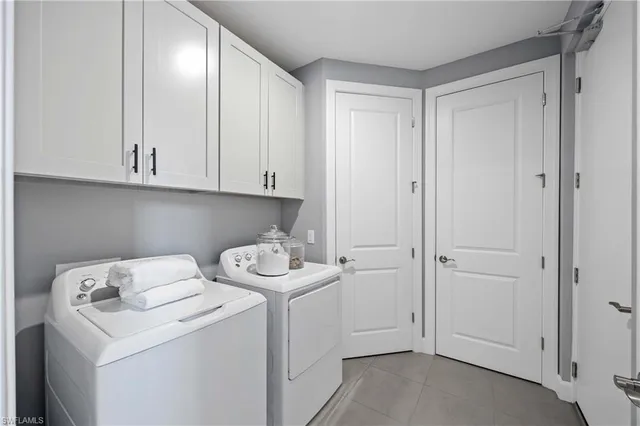a view of storage and utility room with washer and dryer