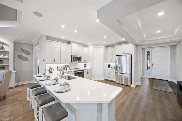 a large kitchen with a table and chairs
