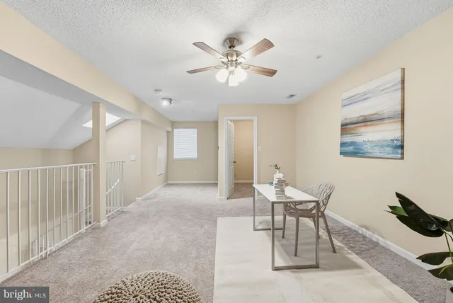 a workspace with furniture and white walls