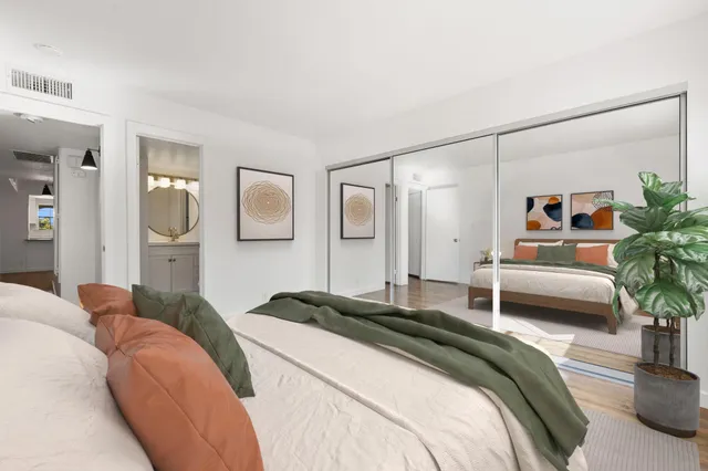 a bedroom with a balcony a bed and a couch