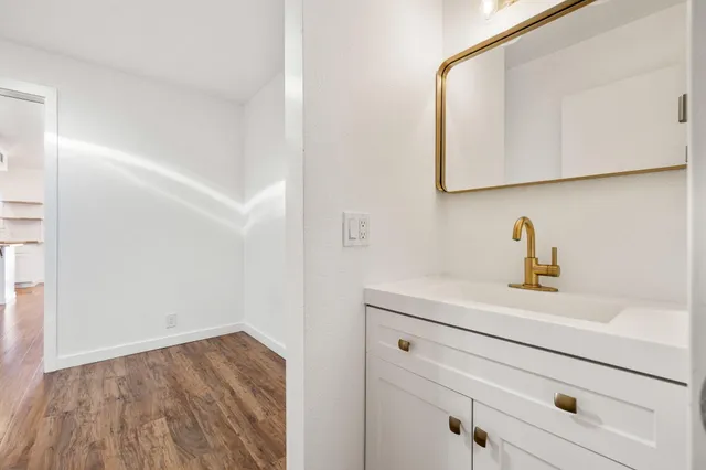 a bathroom with a sink and a mirror