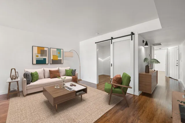 a living room with furniture and a table