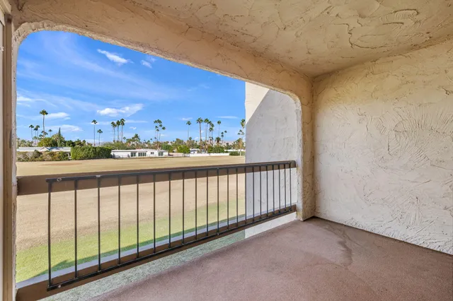 a view of balcony with furniture