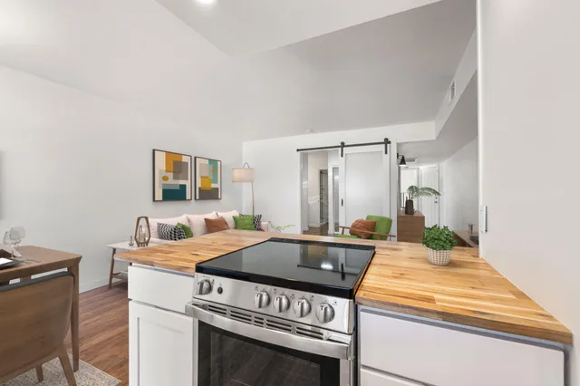 a kitchen with a stove and a sink