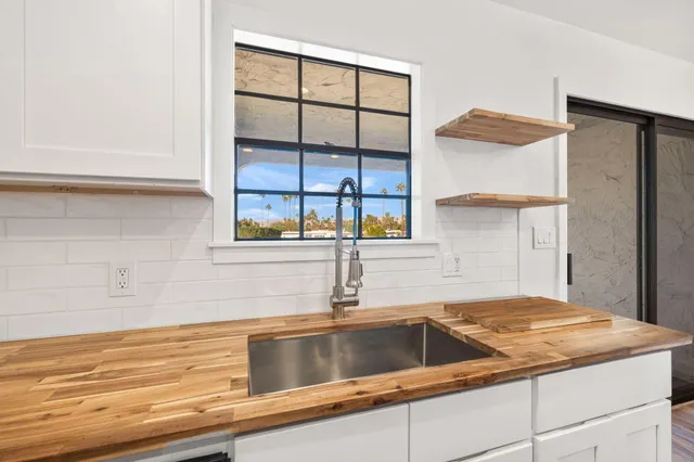a kitchen with a sink and a window