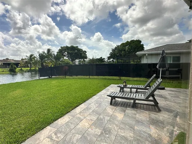 a view of a table and chairs in the garden