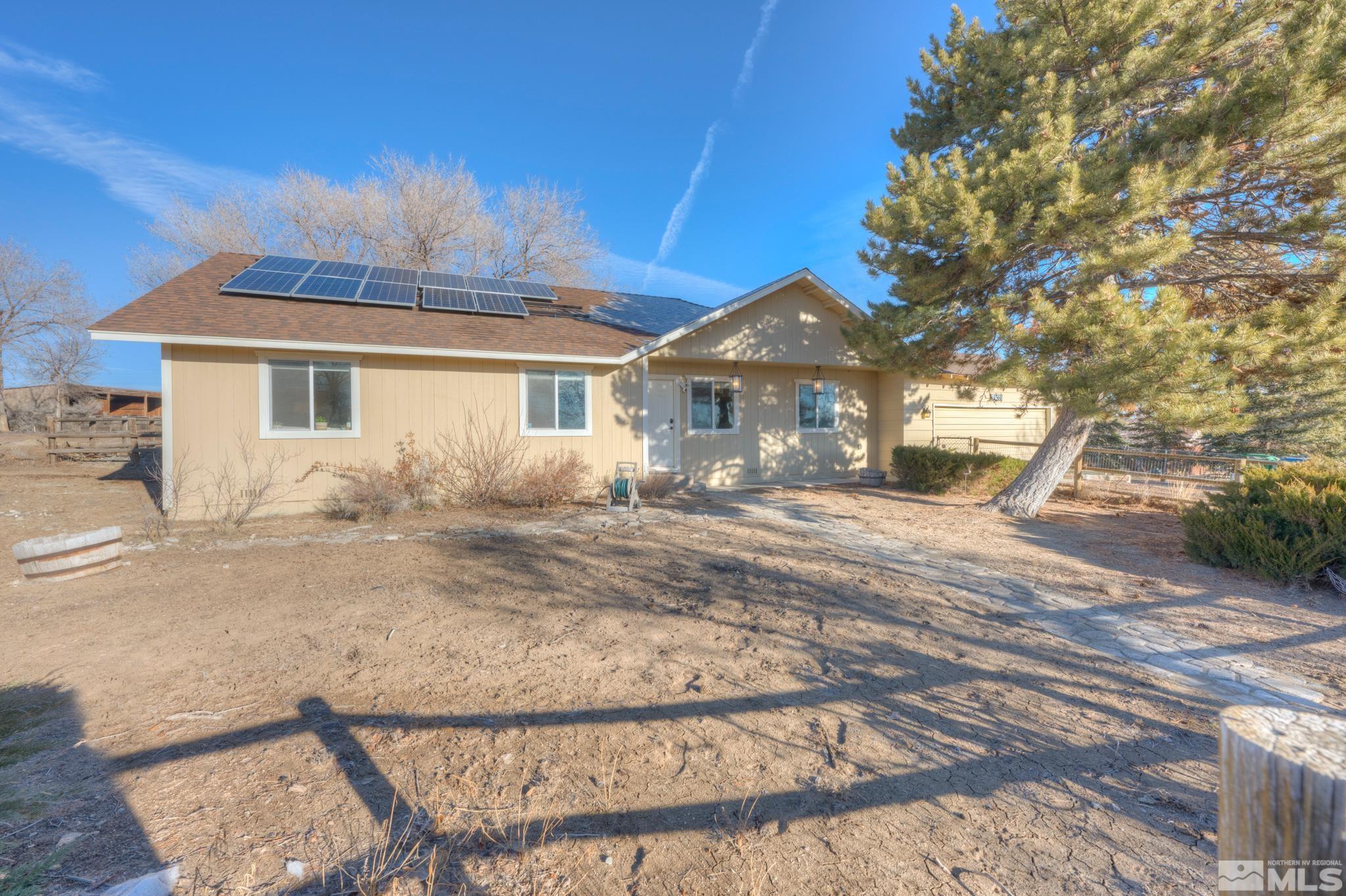 10500 Wells Fargo Road Reno, NV 89508 - Photo 1 of 37 a front view of a house with a yard