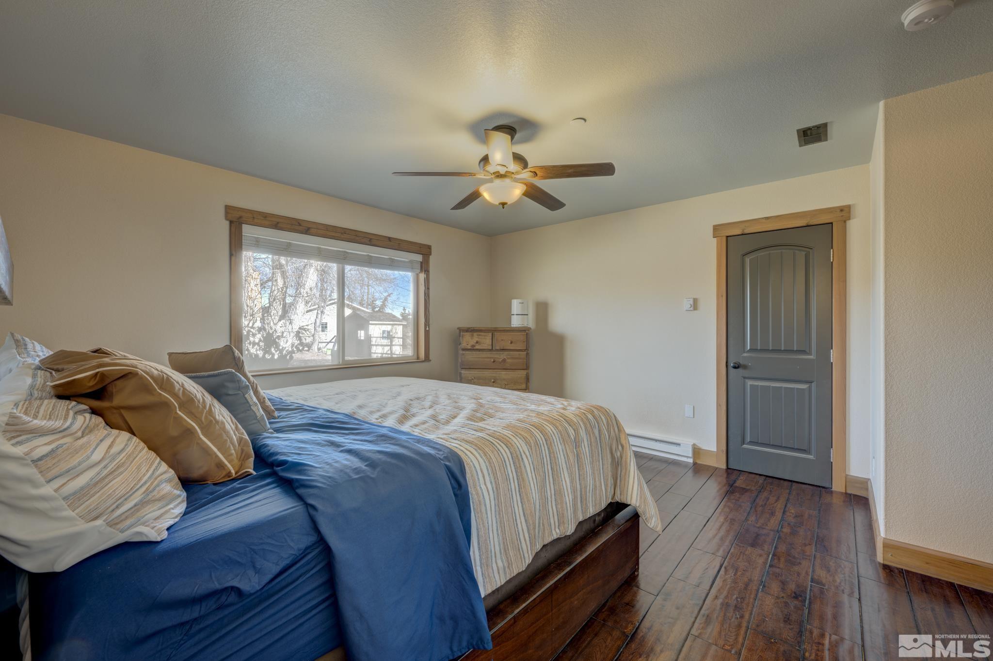10500 Wells Fargo Road Reno, NV 89508 - Photo 15 of 37 a bedroom with a bed and a window