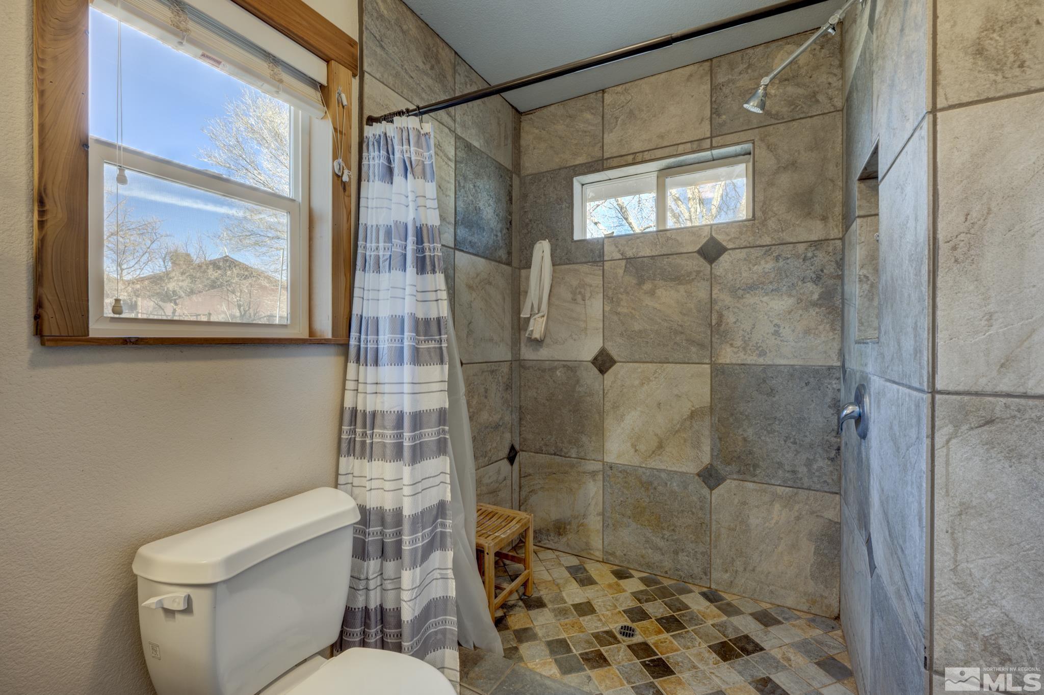 10500 Wells Fargo Road Reno, NV 89508 - Photo 17 of 37 a bathroom with a shower and toilet