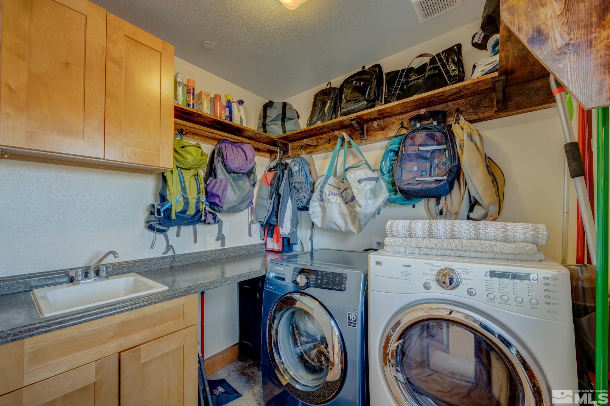10500 Wells Fargo Road Reno, NV 89508 - Photo 22 of 37 a view of storage and utility room with a washer and dryer