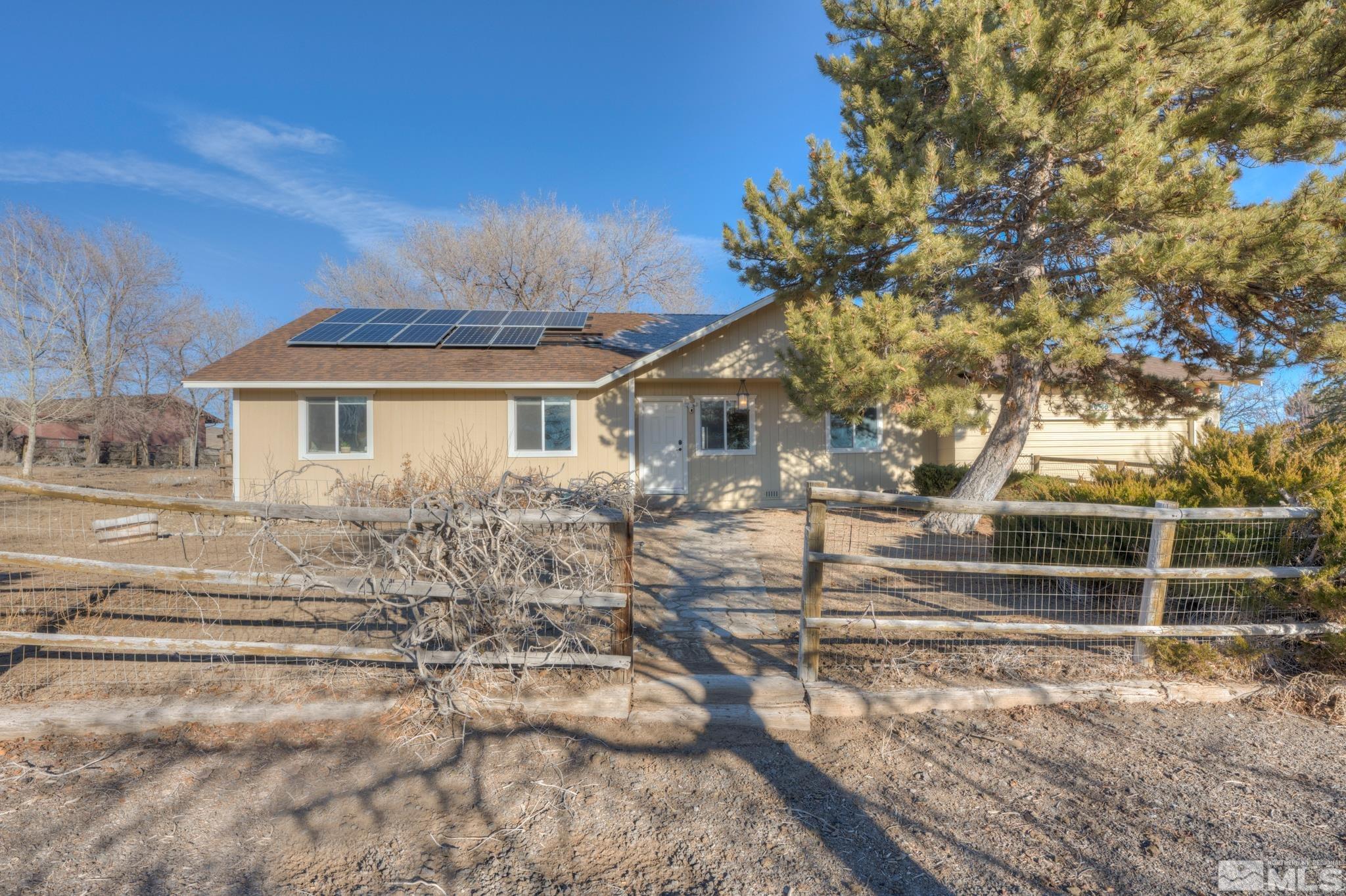 10500 Wells Fargo Road Reno, NV 89508 - Photo 3 of 37 a front view of a house with a yard