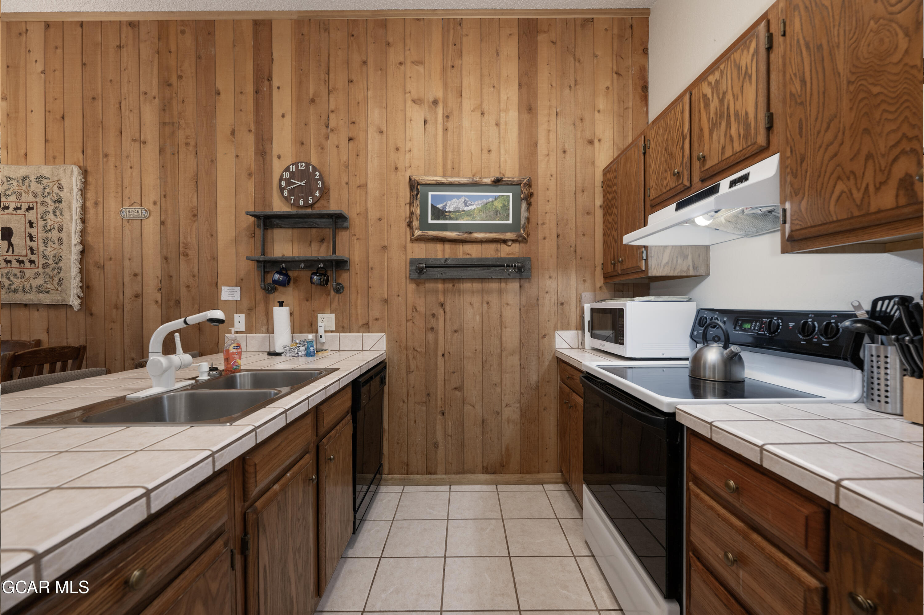 490 Kings Crossing Road, Unit 331 Winter Park, CO 80482 - Photo 8 of 38 a kitchen with stainless steel appliances a sink stove and cabinets