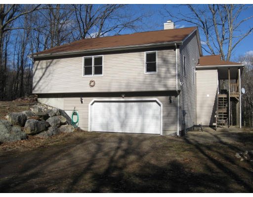 a view of backyard with cabin