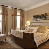 a bedroom with bed and a window