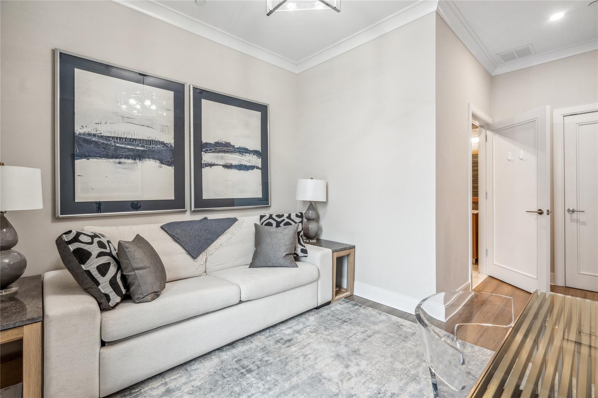 100 Garvies Point Road, Unit 1126 Glen Cove, NY 11542 - Photo 11 of 40 Living room with hardwood / wood-style floors and ornamental molding
