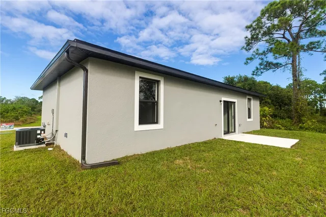 a house with yard in front of it