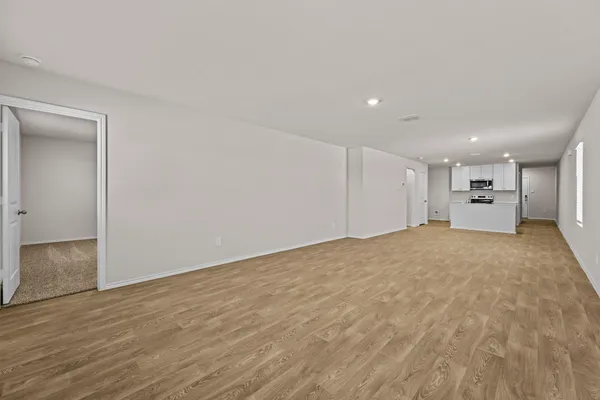 a view of an empty room and entryway