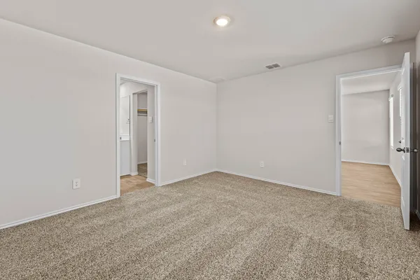 a bathroom with a shower a toilet and sink