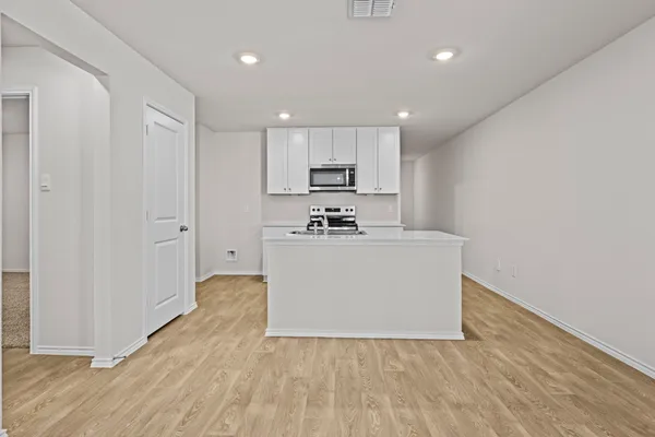 a view of kitchen with wooden floor