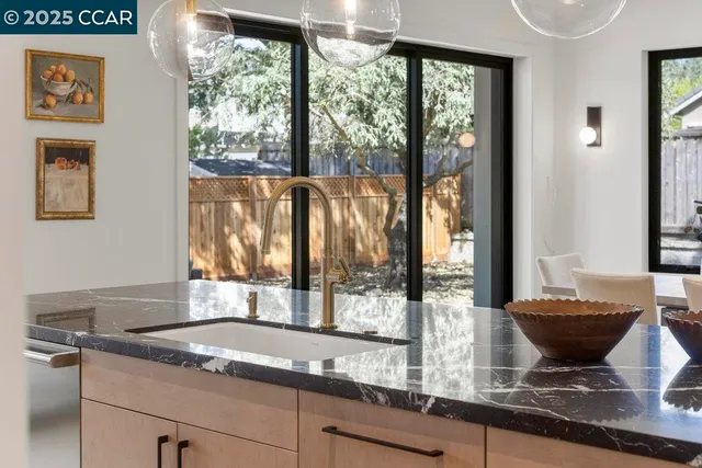 a kitchen with cabinets a sink and counter top space