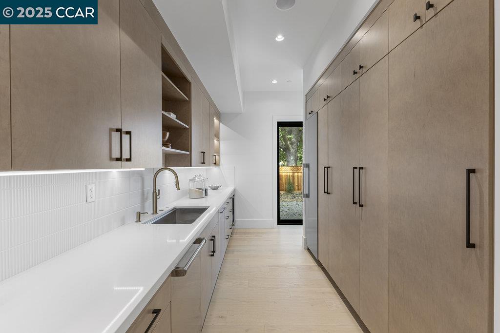 11 Willowmere Road Danville, CA 94526 - Photo 21 of 58 a kitchen with a sink and refrigerator