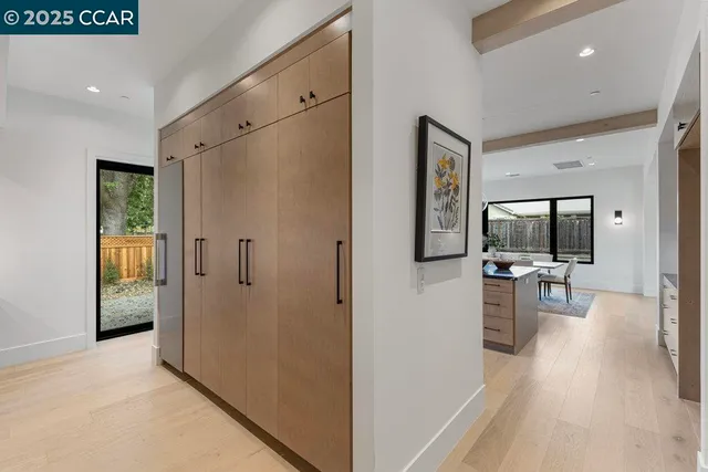 a bedroom with a bed and a mirror