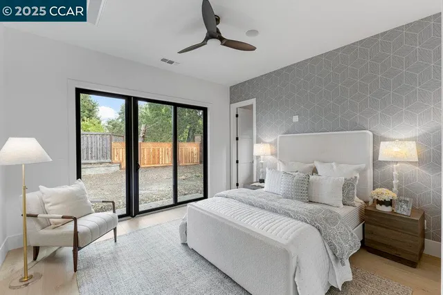a living room with furniture a flat screen tv and a window
