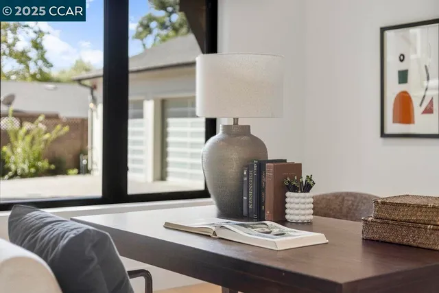 a spacious bedroom with a bed a couch and a flat screen tv