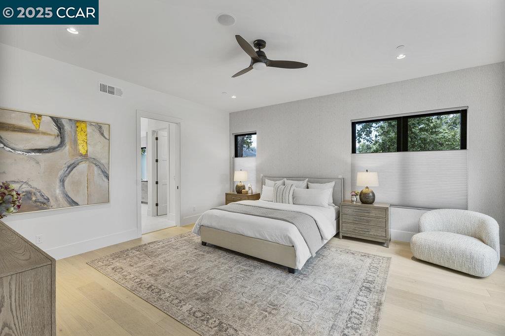 11 Willowmere Road Danville, CA 94526 - Photo 30 of 58 a spacious bedroom with a bed a couch and a flat screen tv