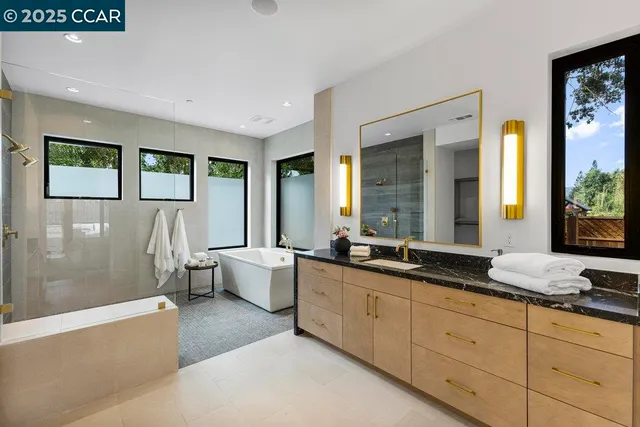 a bathroom with a bathtub and a shower