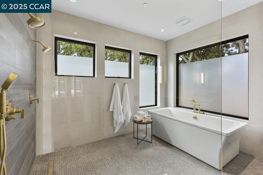 11 Willowmere Road Danville, CA 94526 - Photo 34 of 58 a bathroom with a bathtub and a shower