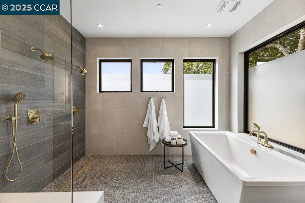 11 Willowmere Road Danville, CA 94526 - Photo 36 of 58 a bathroom with a bathtub and next to a window