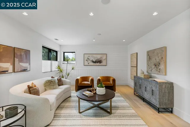 a view of a livingroom with a ceiling fan and window