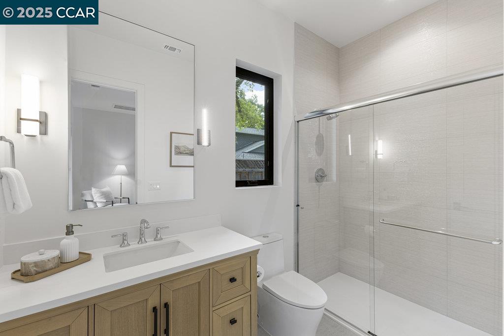 11 Willowmere Road Danville, CA 94526 - Photo 44 of 58 a bathroom with a granite countertop sink toilet and shower