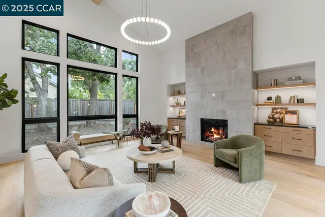 a bedroom with furniture and large window