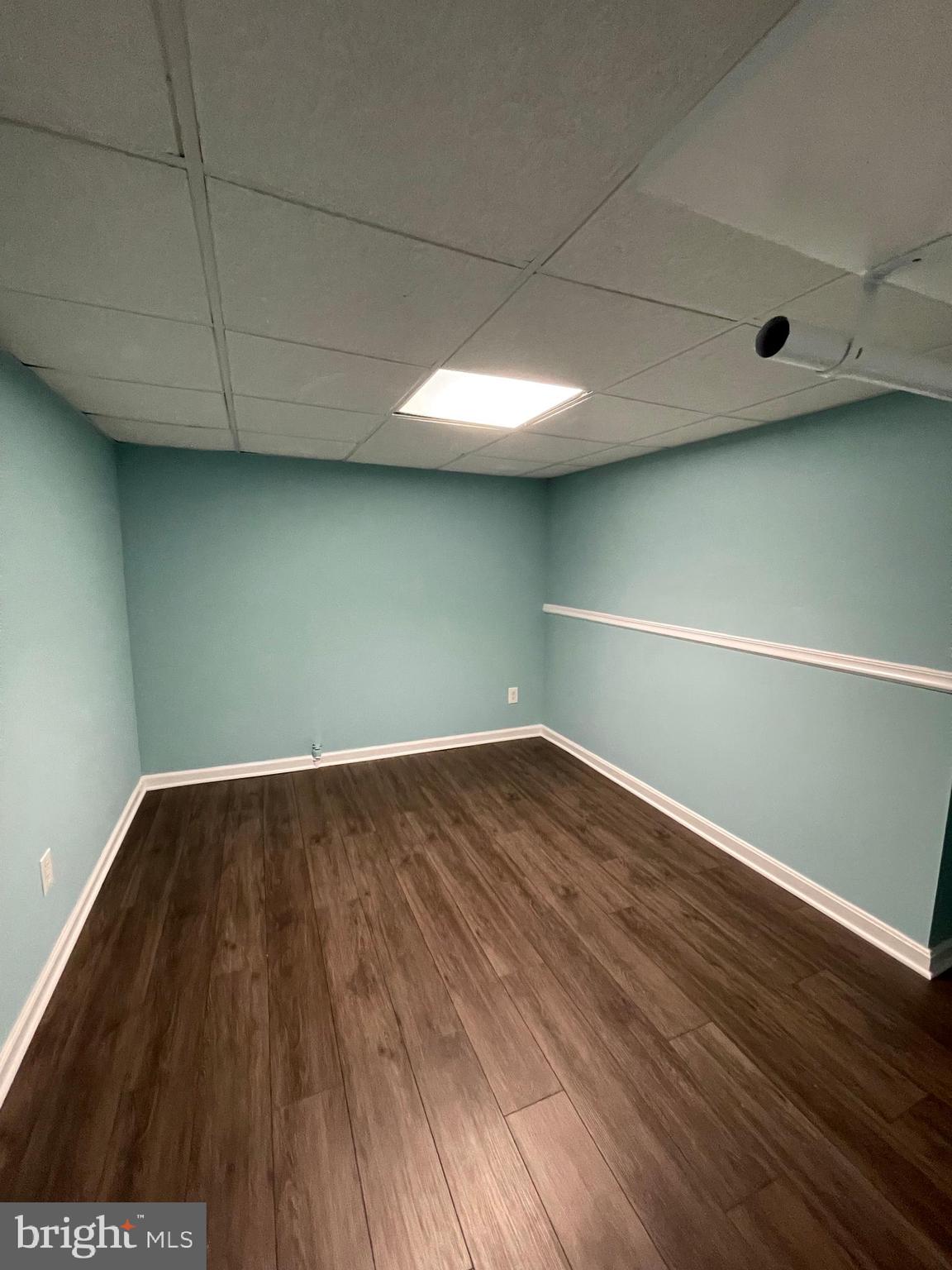 106 Marley Station Road Glen Burnie, MD 21060 - Photo 22 of 36 a view of empty room with wooden floor