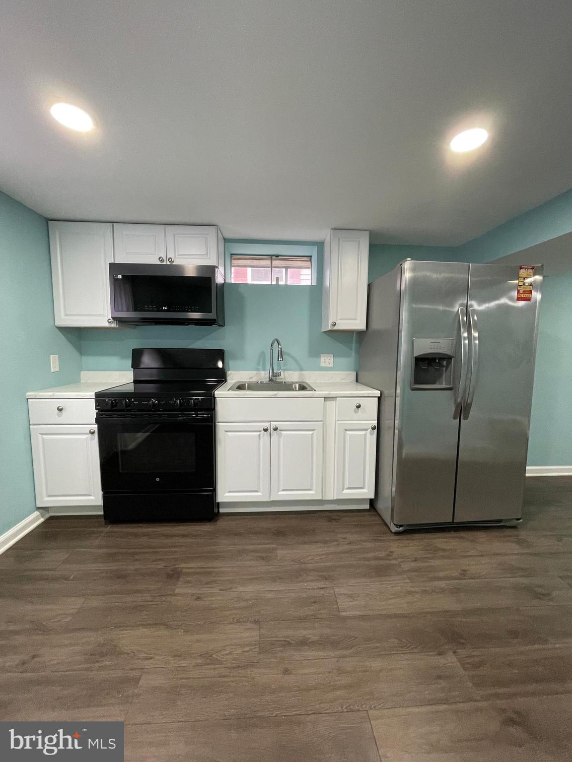 106 Marley Station Road Glen Burnie, MD 21060 - Photo 5 of 36 a kitchen with stainless steel appliances granite countertop a stove a sink and a refrigerator