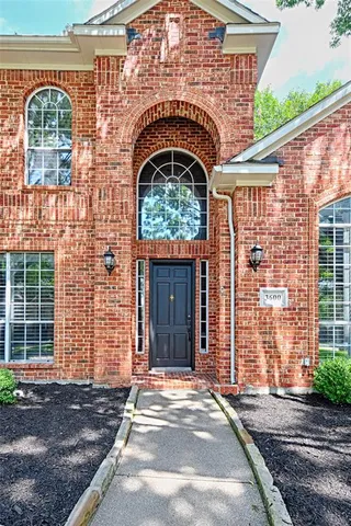 a front view of a house with glass windows