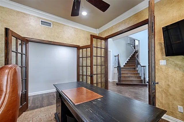 a view of entryway and hall with wooden floor