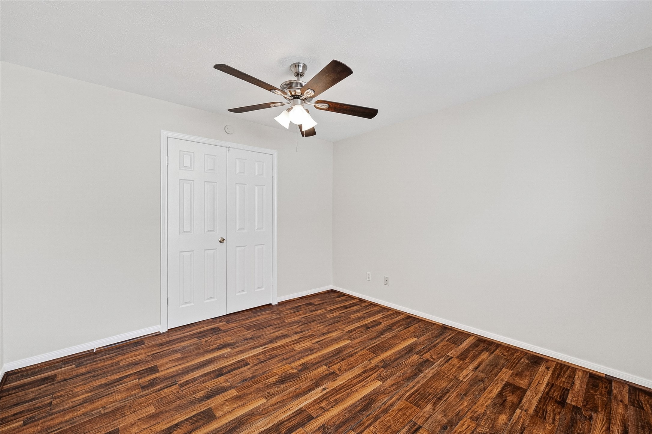 4539 Springfield Lakes Street Sugar Land, TX 77479 - Photo 16 of 34 a view of empty room with wooden floor