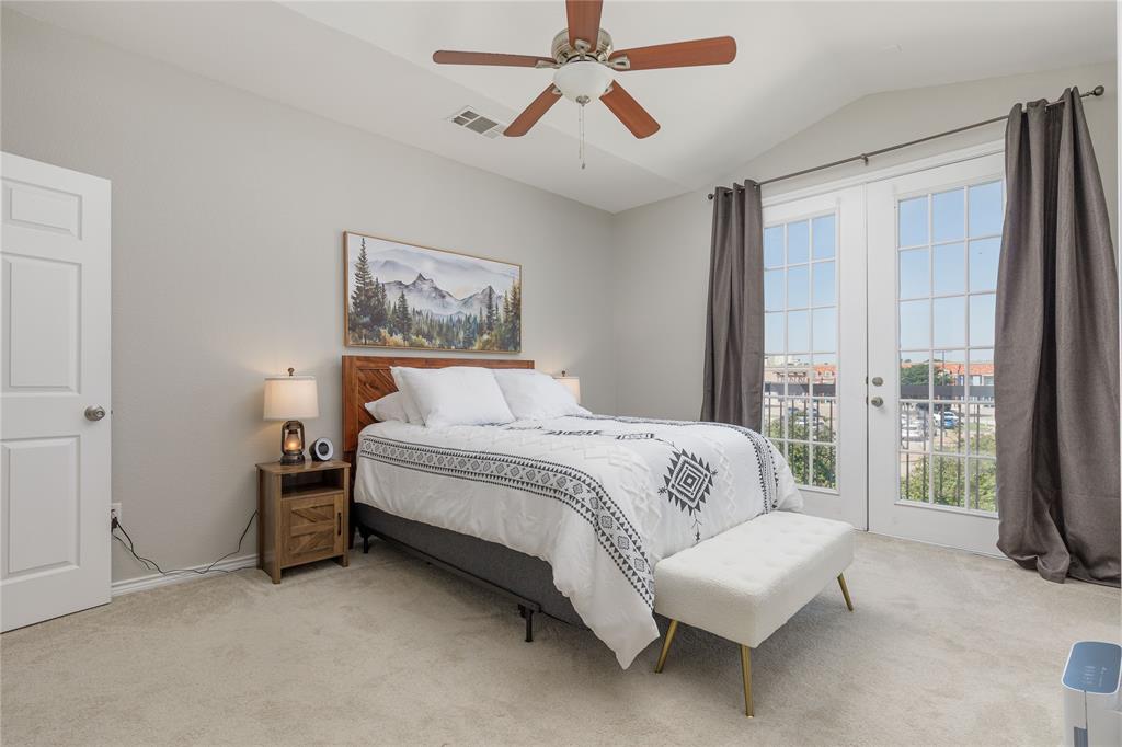 2104 Azure Pointe Richardson, TX 75080 - Photo 15 of 28 a spacious bedroom with a bed and a couch