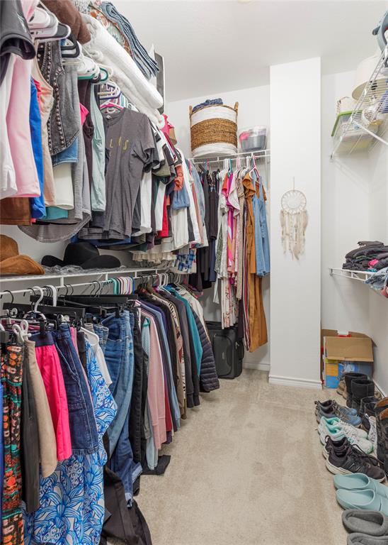 2104 Azure Pointe Richardson, TX 75080 - Photo 19 of 28 a view of walk in closet with clothes