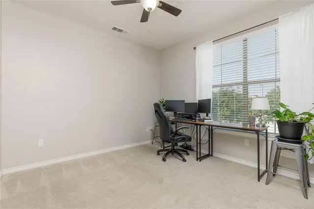 a workspace with furniture and a window