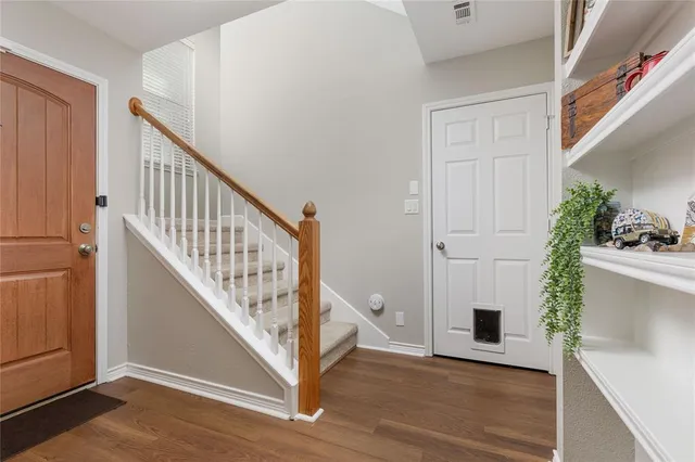 a view of entryway with wooden floor