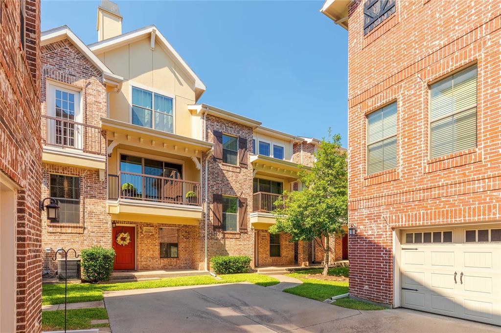 2104 Azure Pointe Richardson, TX 75080 - Photo 28 of 28 a view of a brick building next to a yard