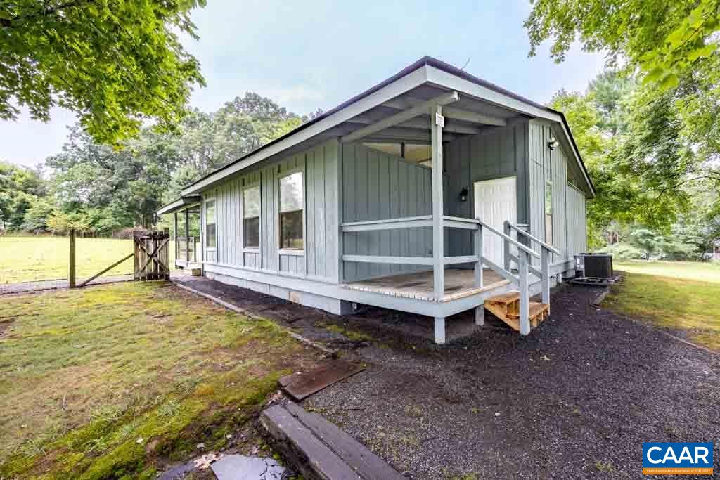 528 Matthew Mill Road Ruckersville, VA 22968 - Photo 1 of 27 a front view of a house with garden