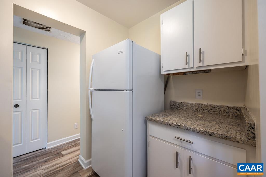 528 Matthew Mill Road Ruckersville, VA 22968 - Photo 12 of 27 a kitchen with granite countertop cabinets and refrigerator