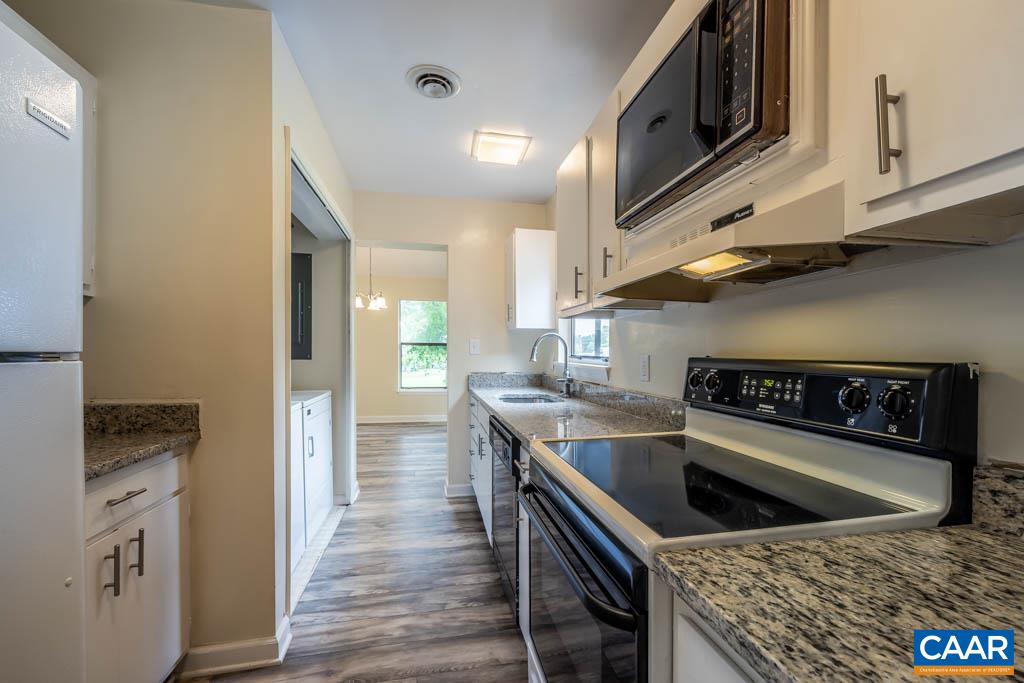 528 Matthew Mill Road Ruckersville, VA 22968 - Photo 14 of 27 a kitchen with stainless steel appliances granite countertop a stove a sink and a refrigerator